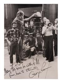 [LUCAS, George (b. 1944)]. Original photograph from the set of Star Wars with personal inscription from George Lucas. 1977.