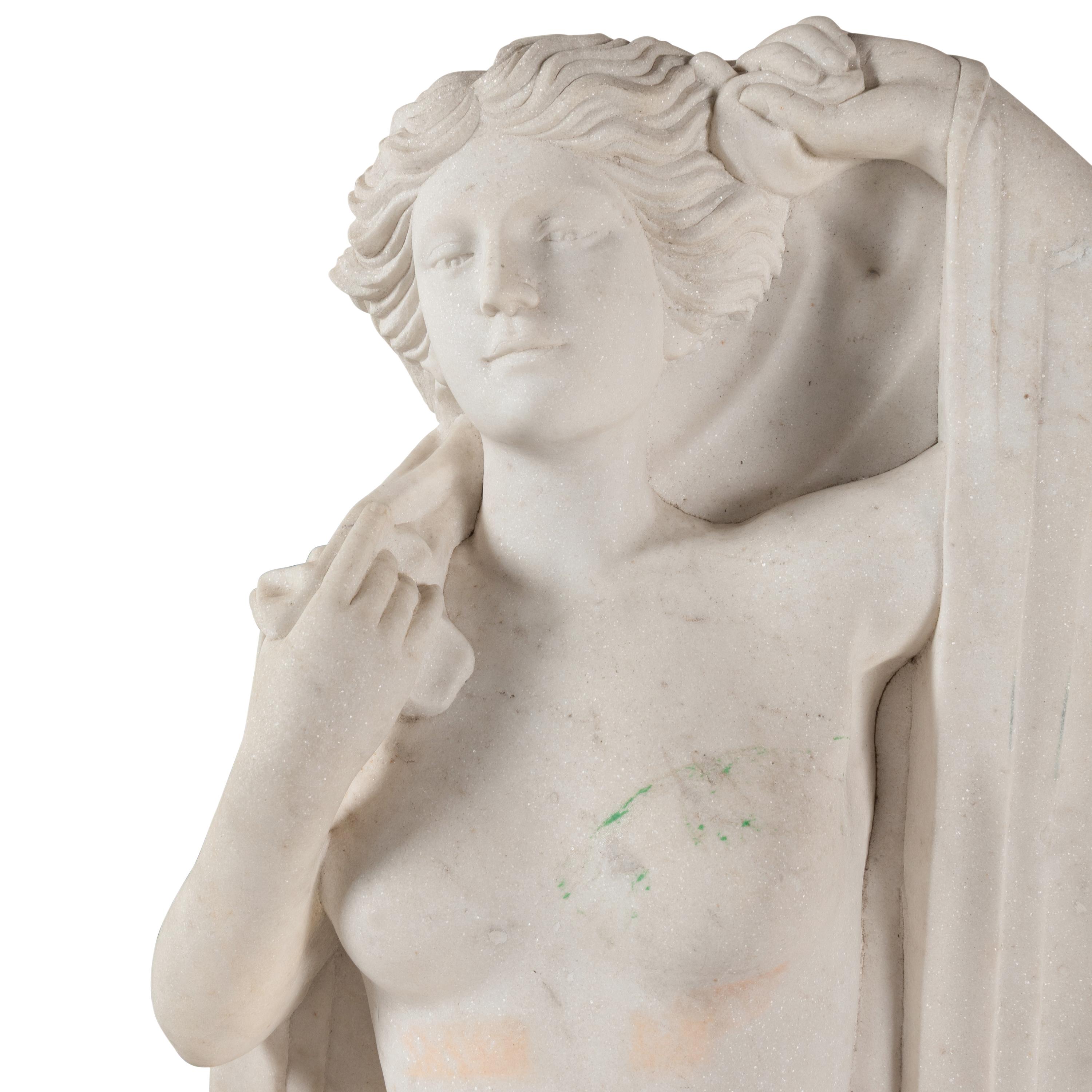 A Carved Marble Figure of a Maiden