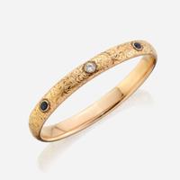 An antique gold, diamond, and sapphire bangle