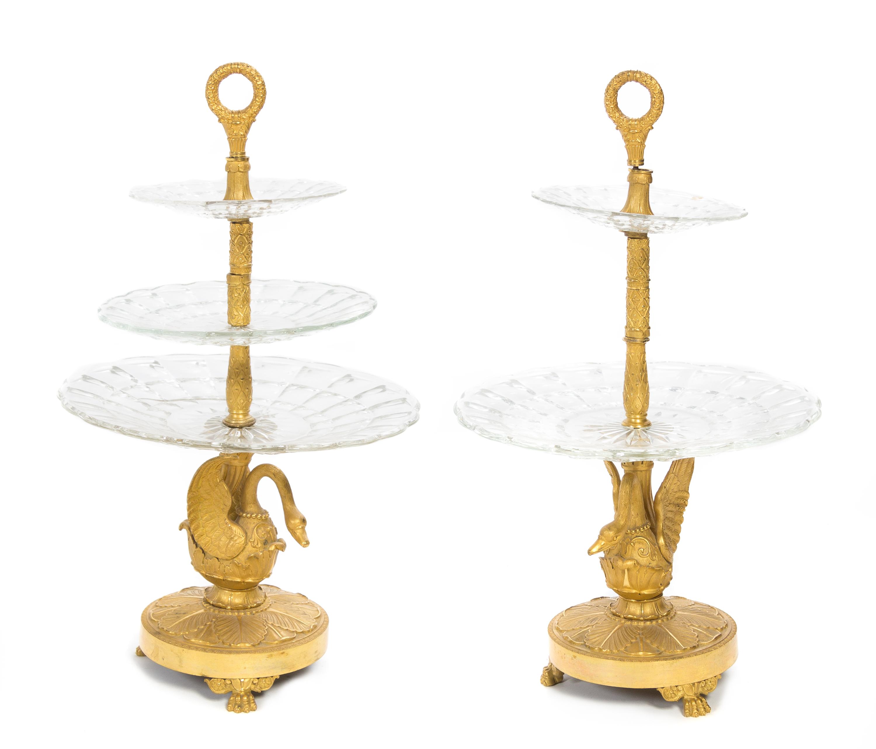 A Pair of Empire Style Gilt Bronze and Cut Glass Three-Tier Stands Height 18 inches.