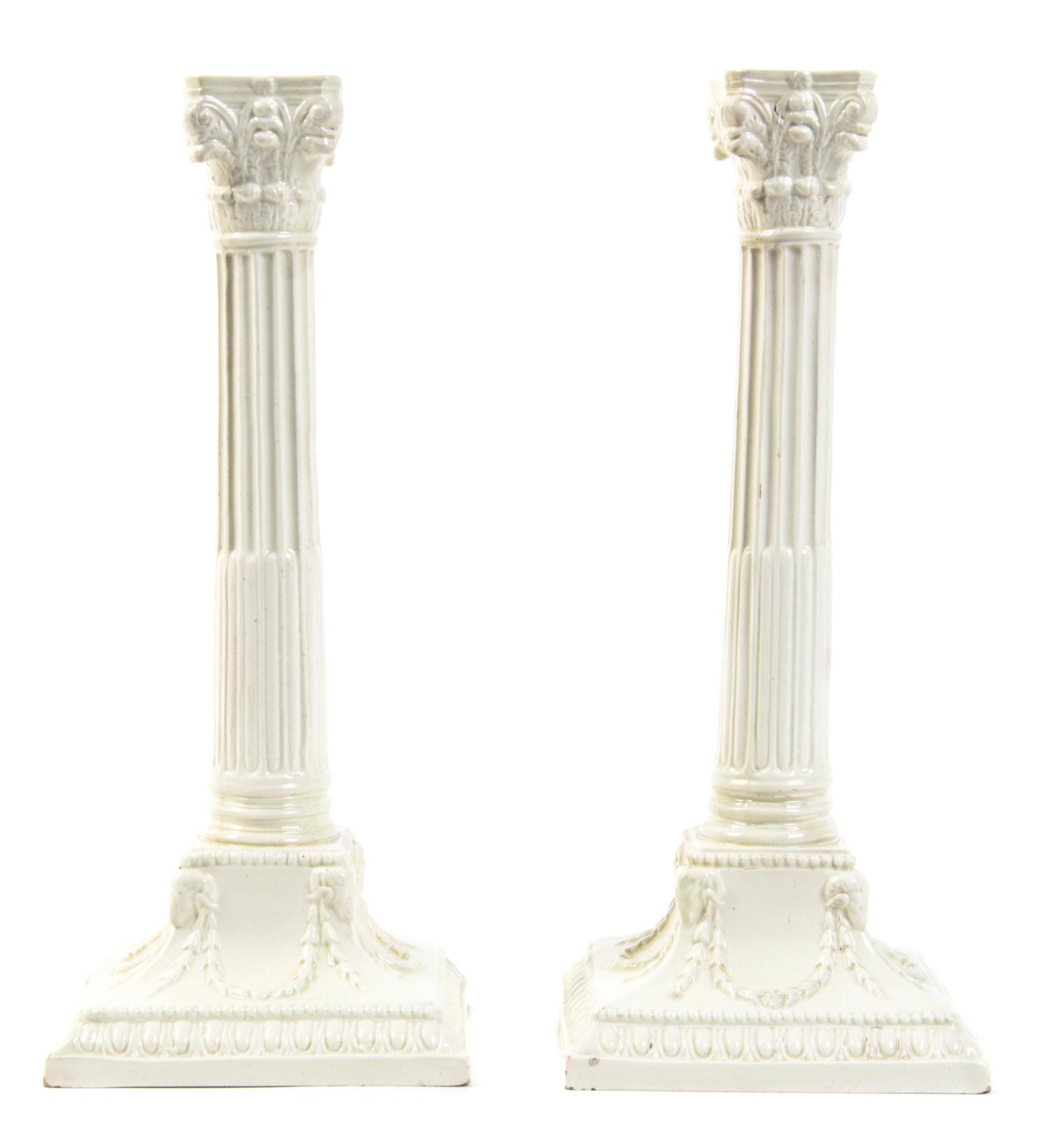 A Pair of English Creamware Candlesticks, Height 10 3/8 inches.