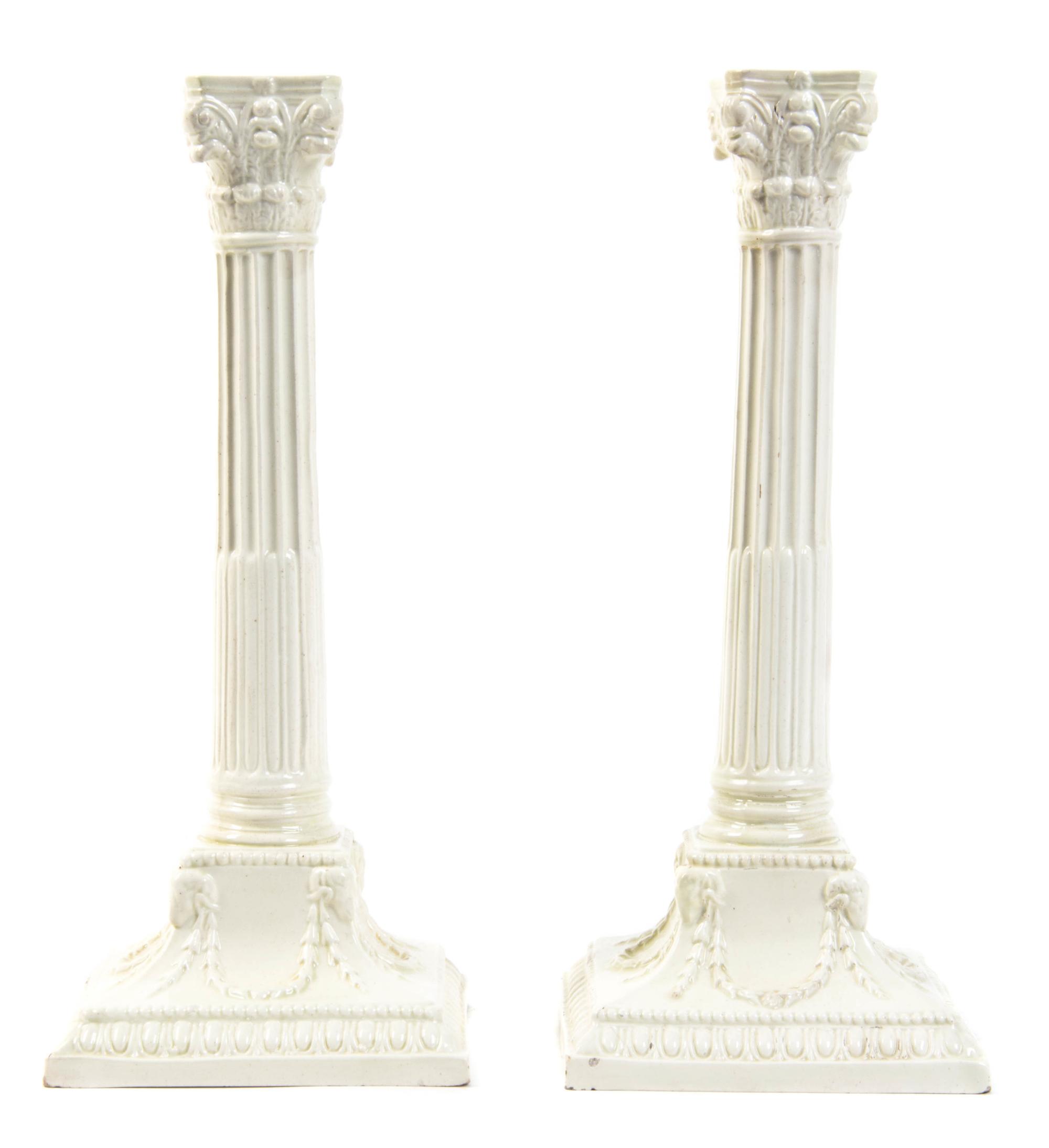 A Pair of English Creamware Candlesticks, Height 10 3/8 inches.