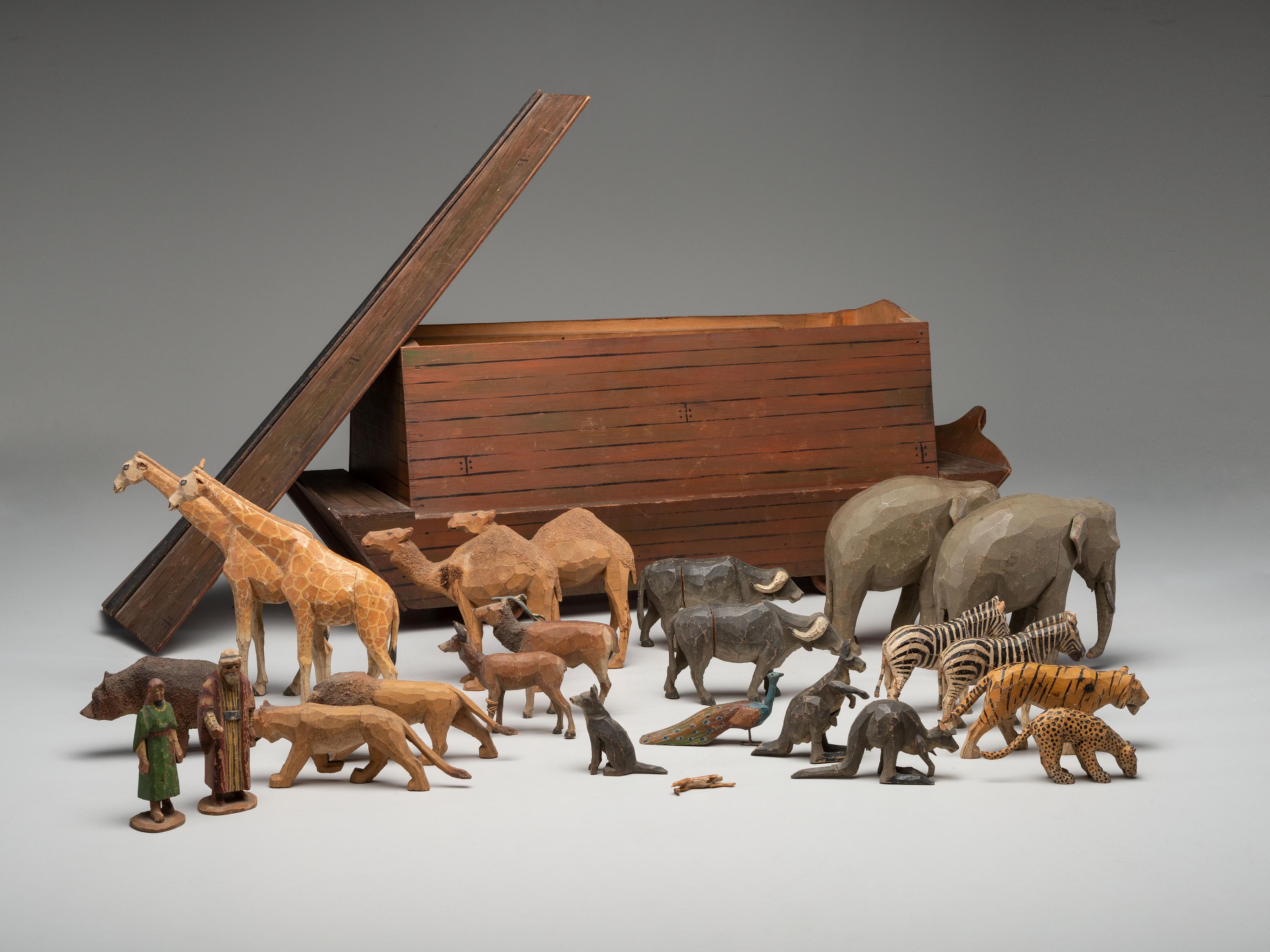 A Folk Art Carved Noah's Ark with Lift-Off Cover and Twenty-Four Figures