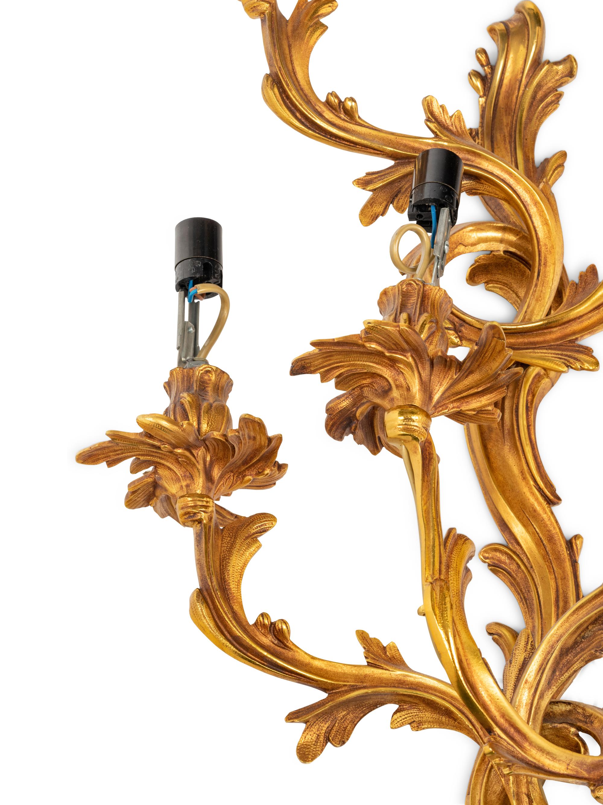 A Set of Four Louis XV Style Gilt Metal Five-Light Sconces