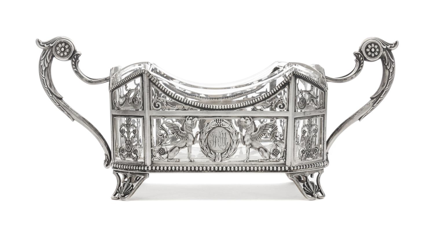 A Russian Silver Mounted Cut Glass Basket, Mark of Fedor Lorie, Assay of A. Romanov, Moscow, 1885, the handled pierce decorated body wi