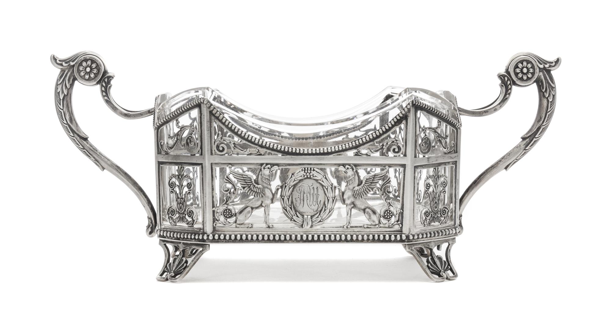 A Russian Silver Mounted Cut Glass Basket, Mark of Fedor Lorie, Assay of A. Romanov, Moscow, 1885, the handled pierce decorated body wi