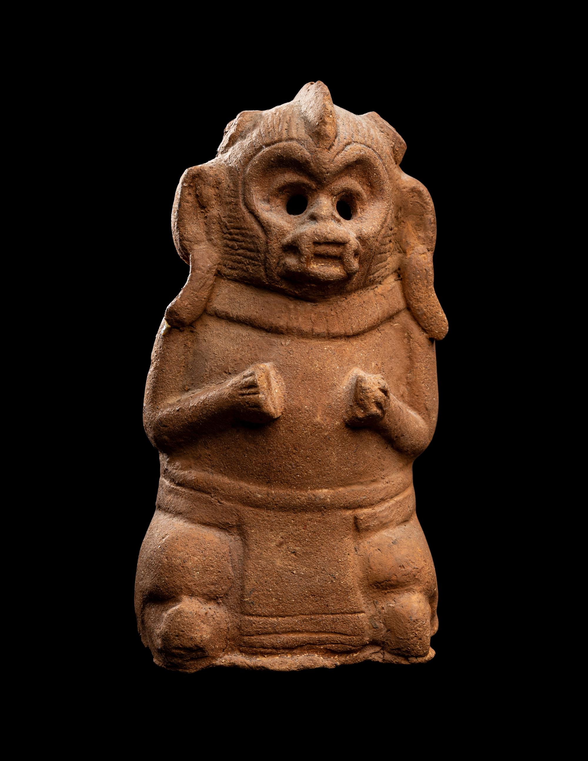 A Maya Figurine of a Seated Monkey