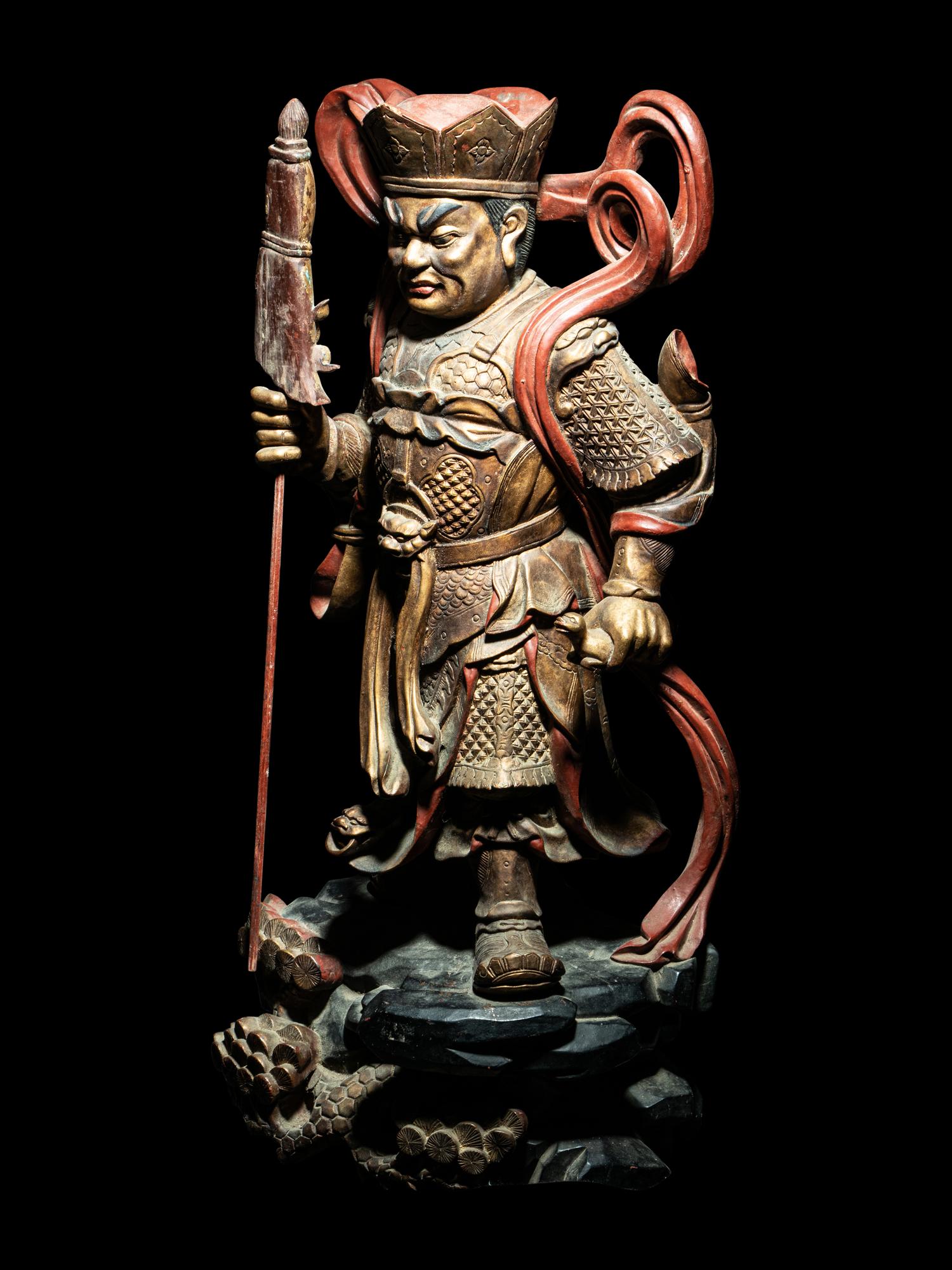 A Set of Four Gilt and Red Lacquered Wood Figures of Guardians