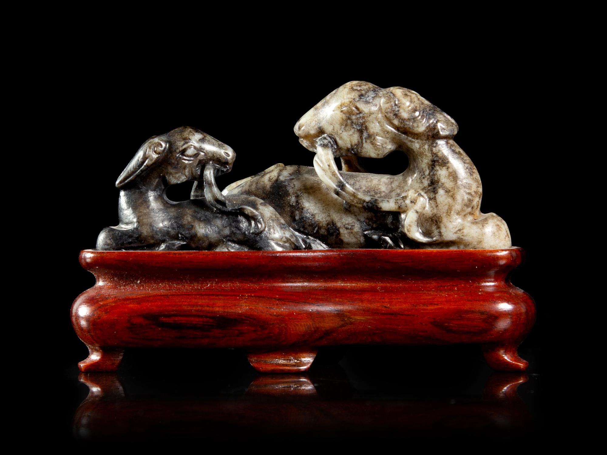 A Chinese Grey and Black Jade Figural Group of Double Rams