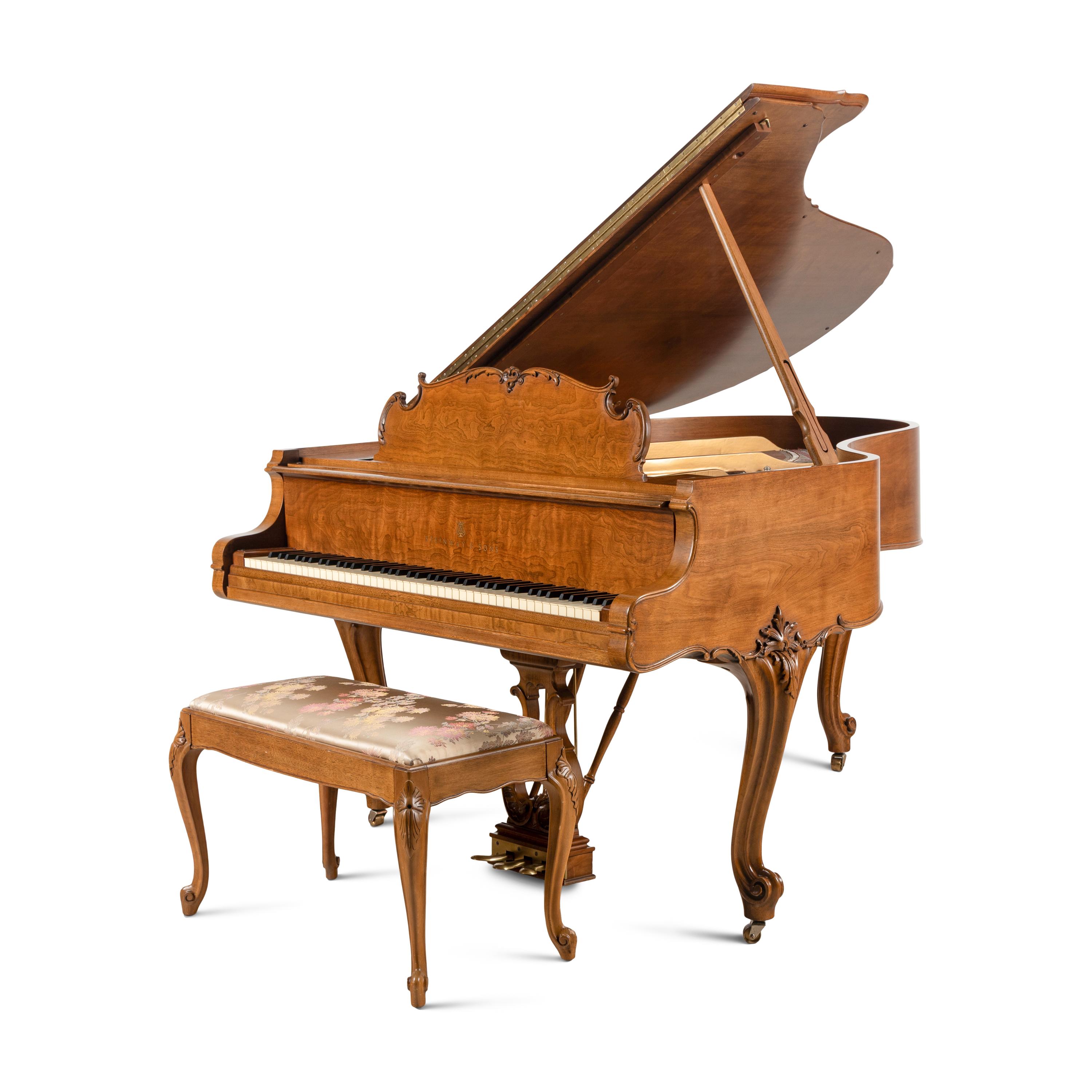 A Steinway and Sons Walnut Grand Piano