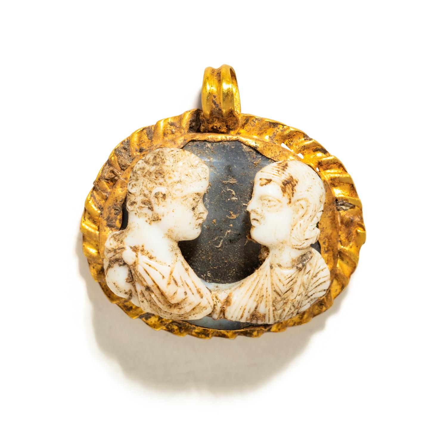A Roman Gold and Onyx Double-Portrait Cameo Pendant