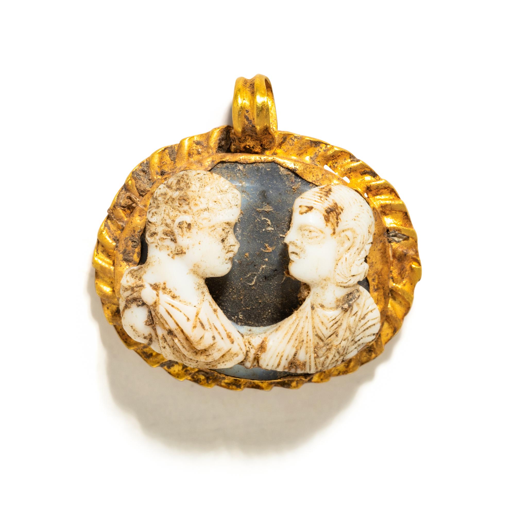 A Roman Gold and Onyx Double-Portrait Cameo Pendant