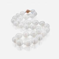 A Silver and Gold Men's Ring and Baroque Pearl Necklace
