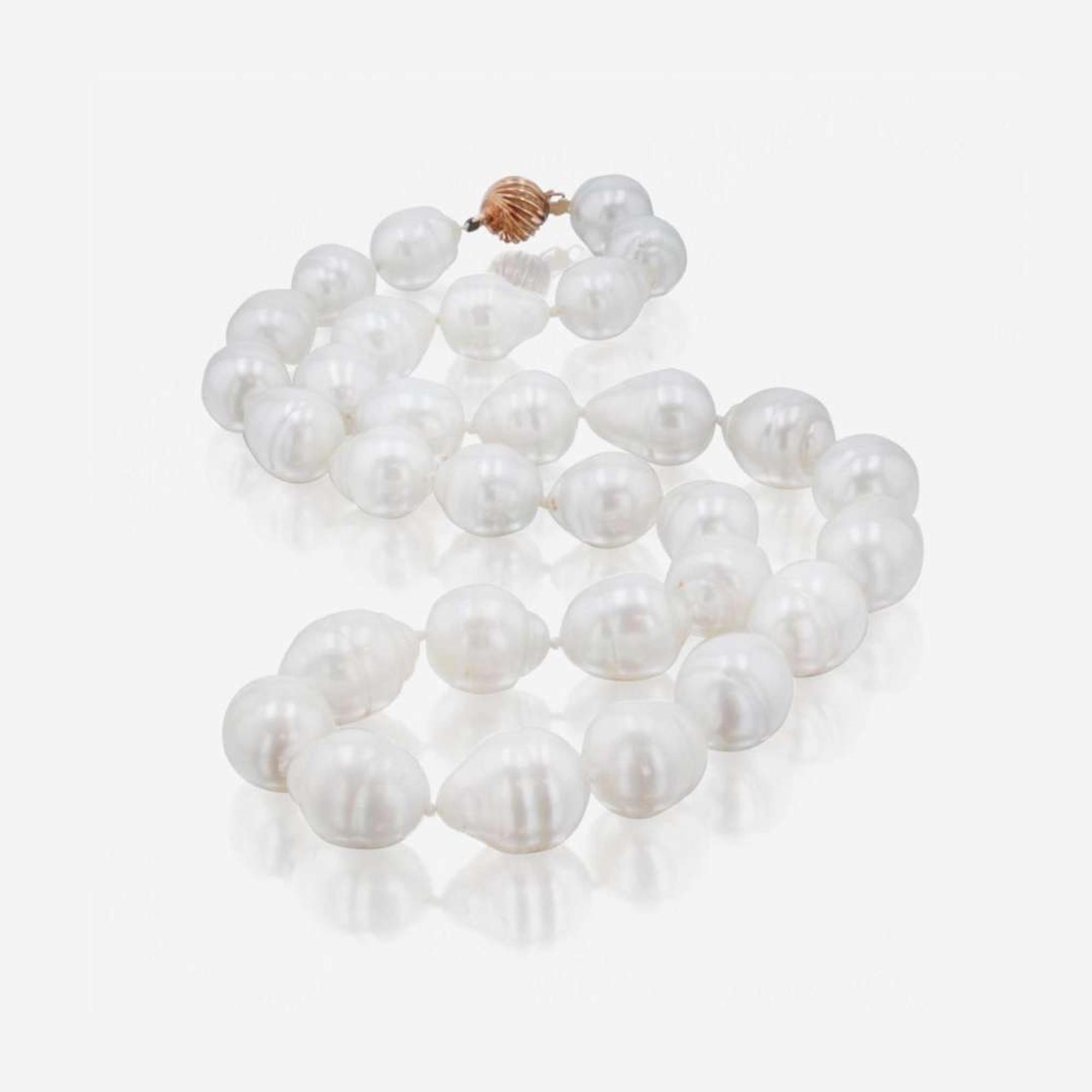 A Silver and Gold Men's Ring and Baroque Pearl Necklace