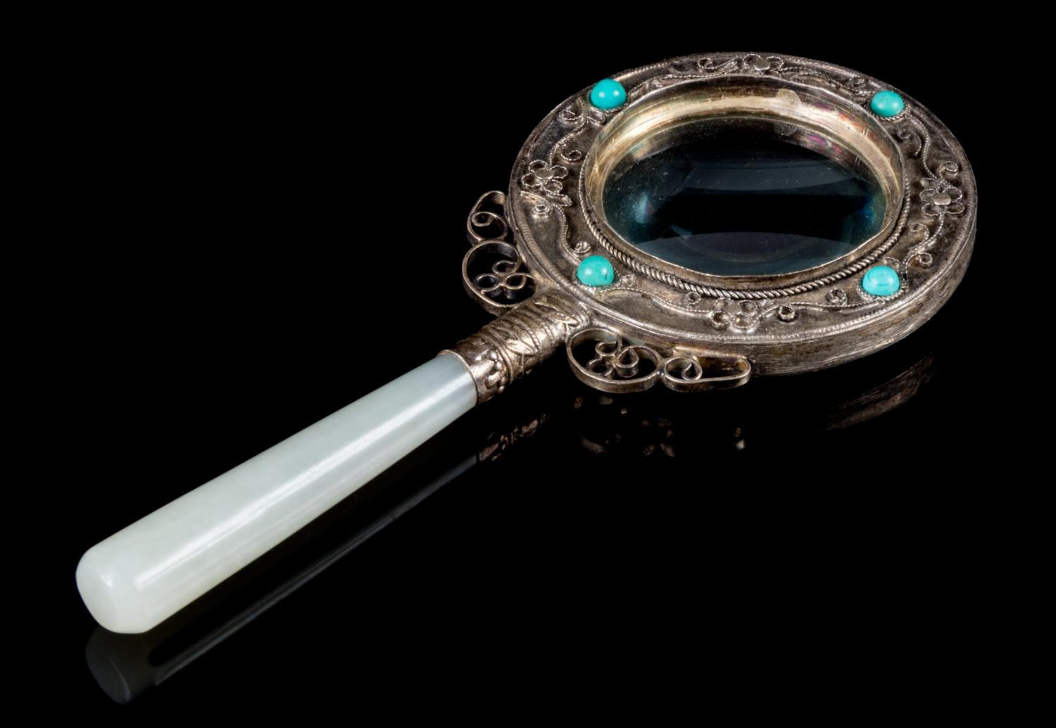 A White Jade and Silver Magnifying Glass Length 6 3/4 inches, width 3 inches.