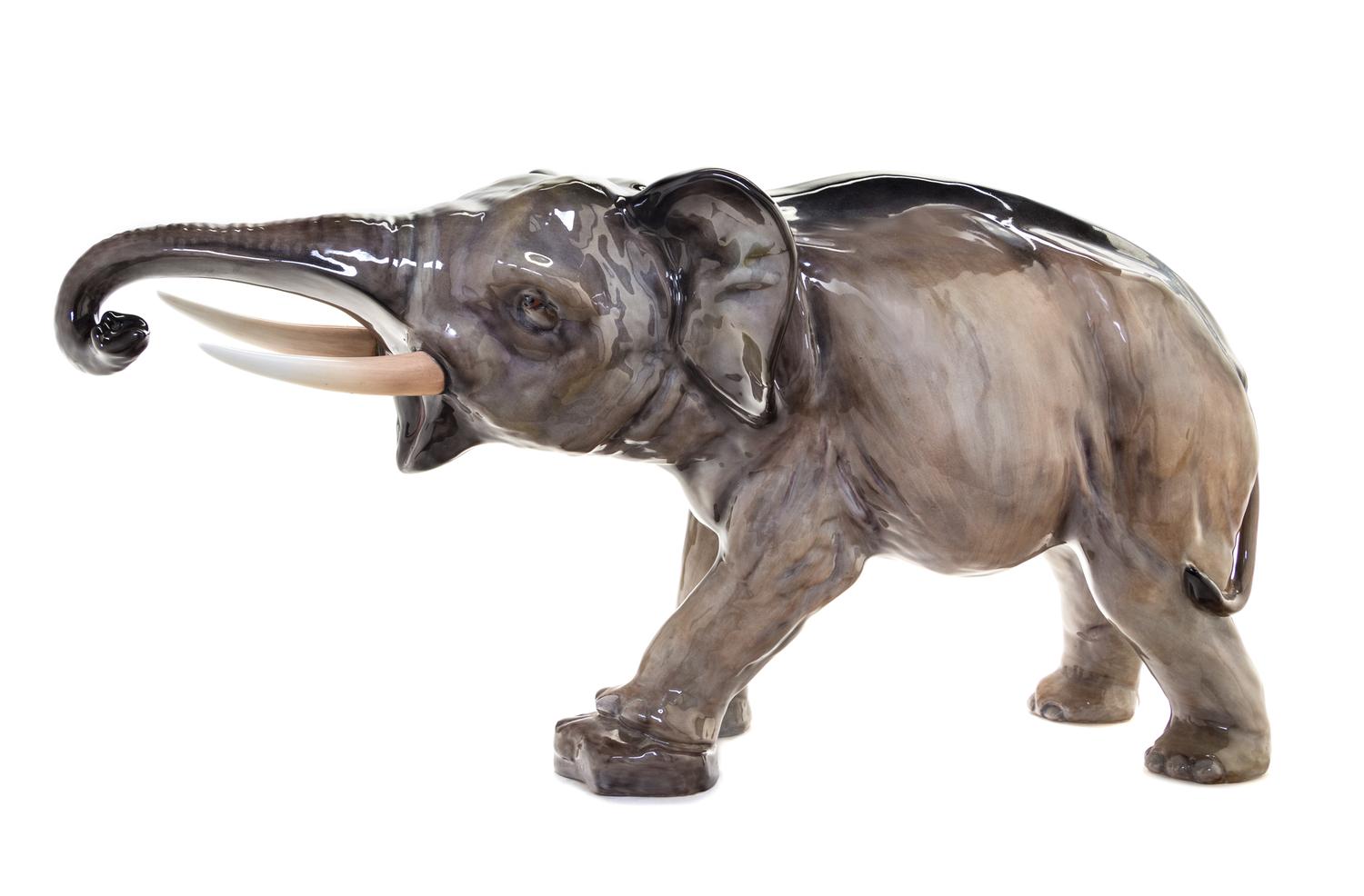 A Royal Doulton Porcelain Model of an Elephant Width 23 inches. — MODELED BY CHARLES JOHN NOKE, CIRCA 1930