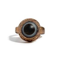 A Near Eastern Banded Agate Cabochon — Set in a gold ring