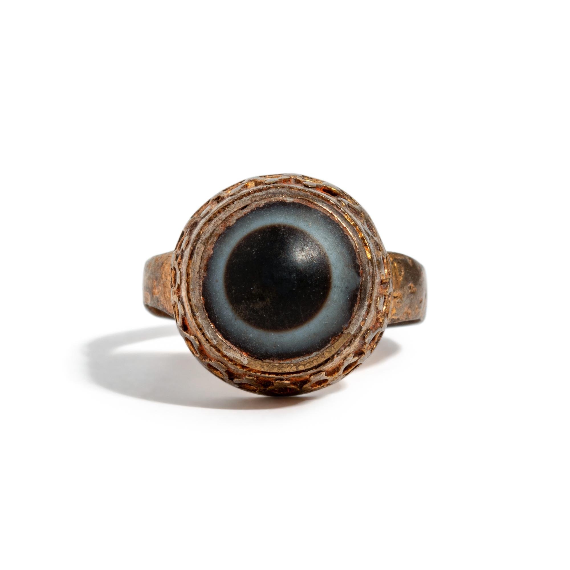 A Near Eastern Banded Agate Cabochon — Set in a gold ring