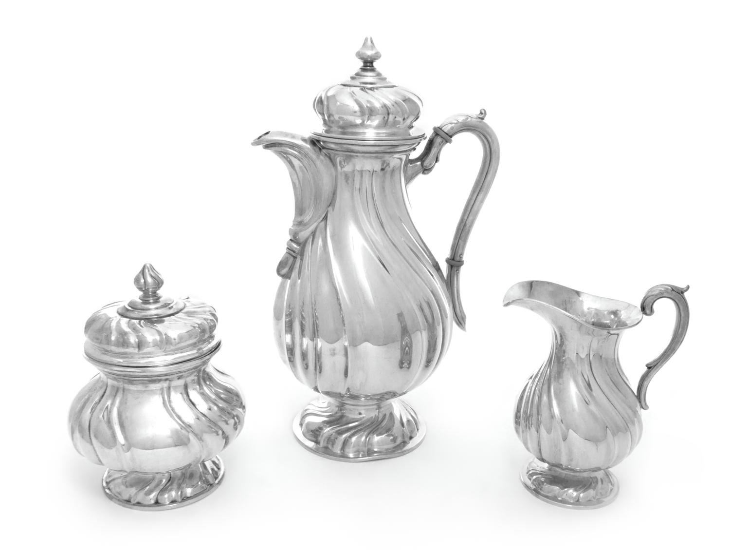A German Silver Three-Piece Coffee Service, M. H. Wilkens & Sohne, Bremen-Hemelingen, each having a baluster form body with twist decor