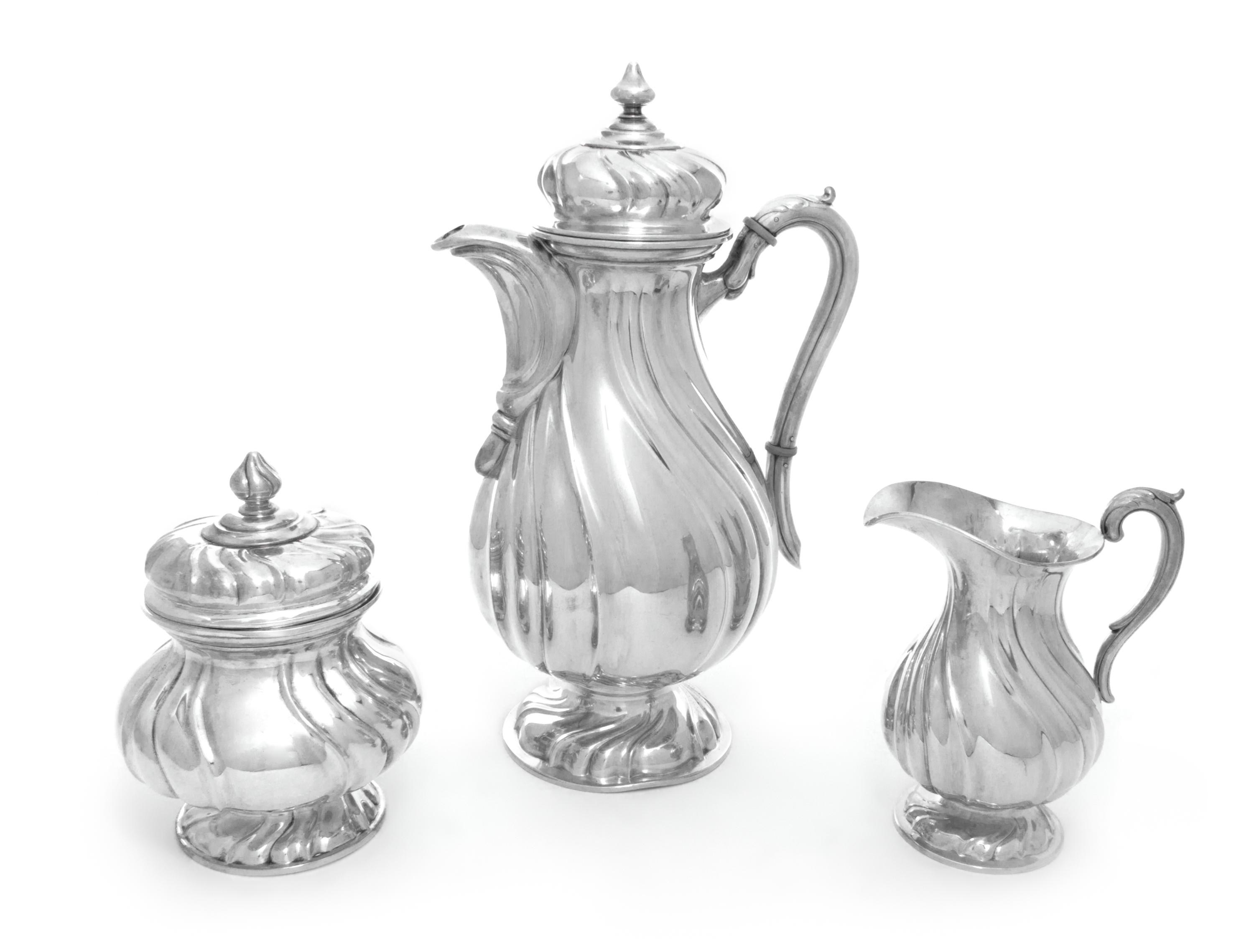 A German Silver Three-Piece Coffee Service, M. H. Wilkens & Sohne, Bremen-Hemelingen, each having a baluster form body with twist decor