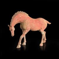 A Chinese red-painted grey pottery figure of a horse with lowered head 红色彩绘陶马 Possibly Tang dynasty ????