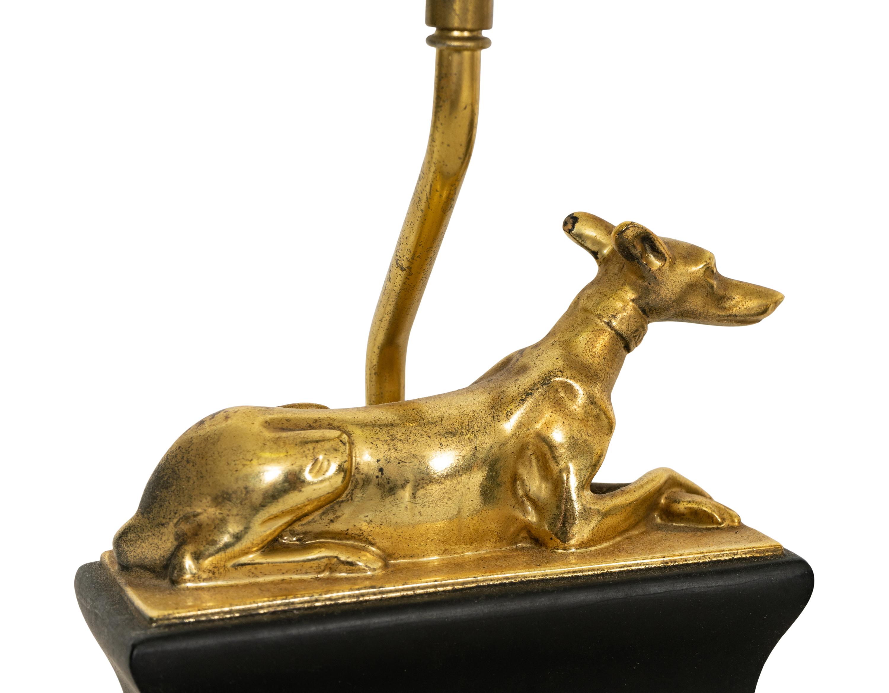 A Pair of Chapman Parcel Gilt Recumbent Canine Lamps