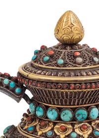 A Tibetan or Himalayan Hardstone Mounted Silver Teapot