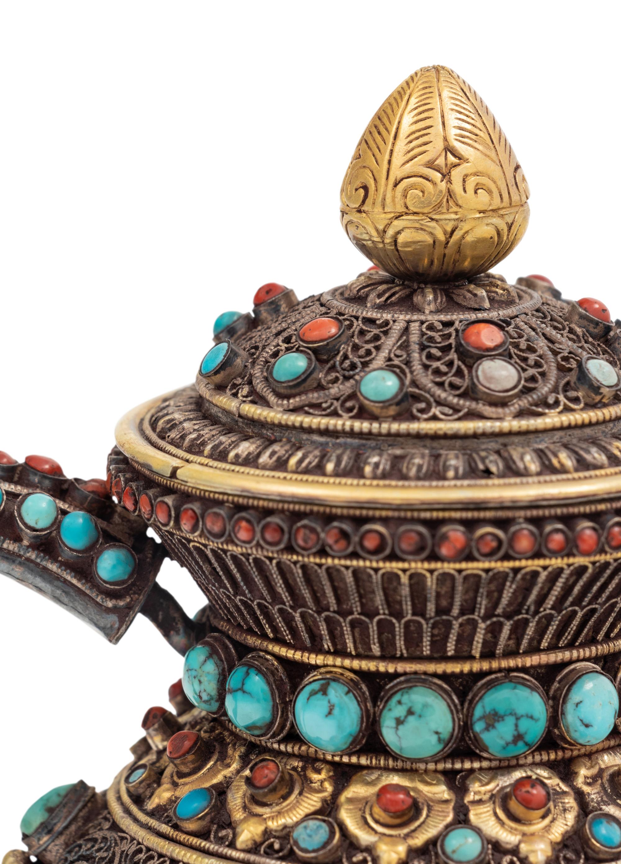 A Tibetan or Himalayan Hardstone Mounted Silver Teapot