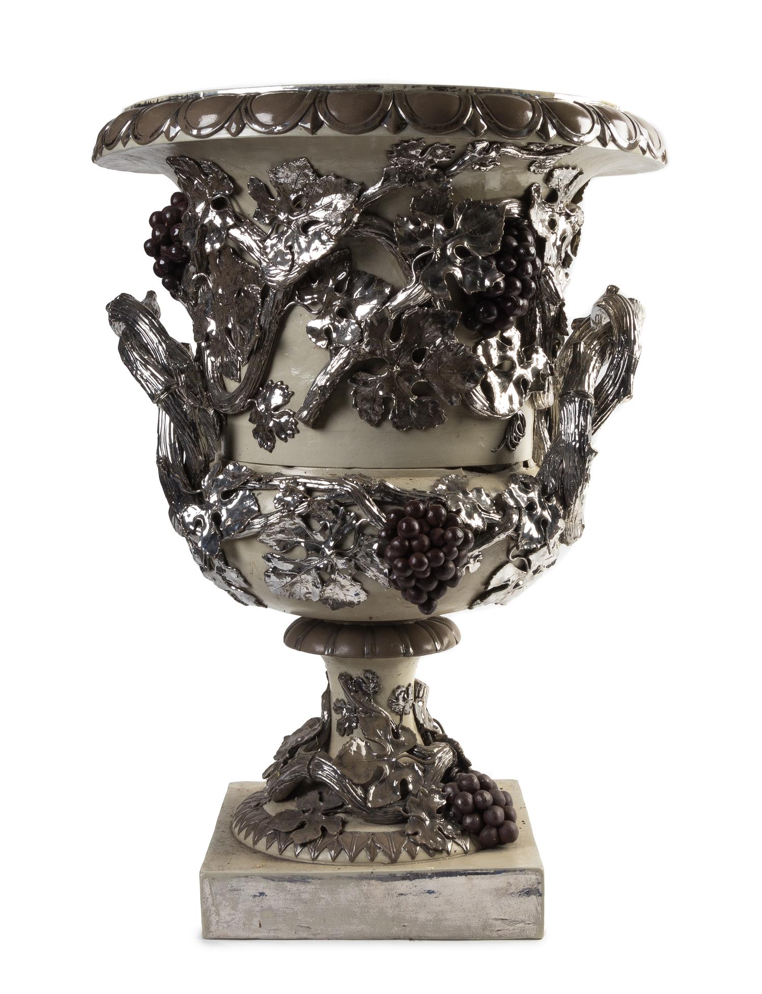 A Glazed and Silvered Ceramic Garden Urn Height 25 x diameter 18 inches.