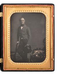 [EARLY PHOTOGRAPHY]. Half plate daguerreotype featuring a gentleman and his sleeping canine companion.