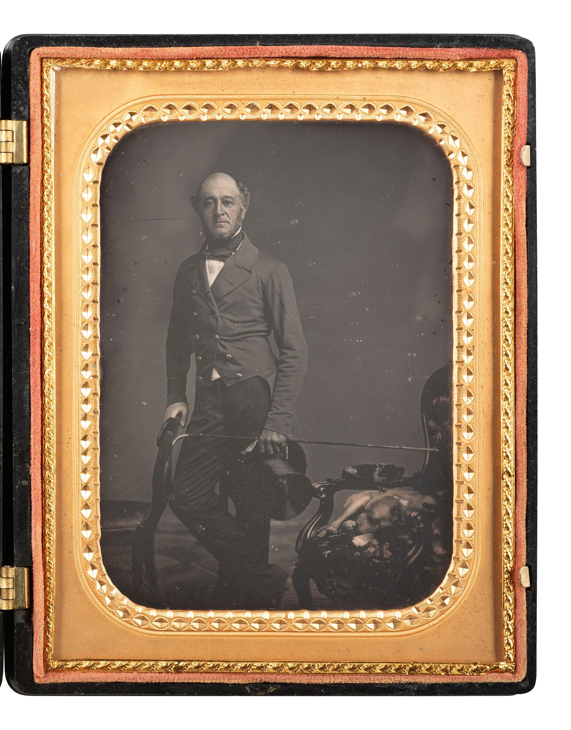 [EARLY PHOTOGRAPHY]. Half plate daguerreotype featuring a gentleman and his sleeping canine companion.