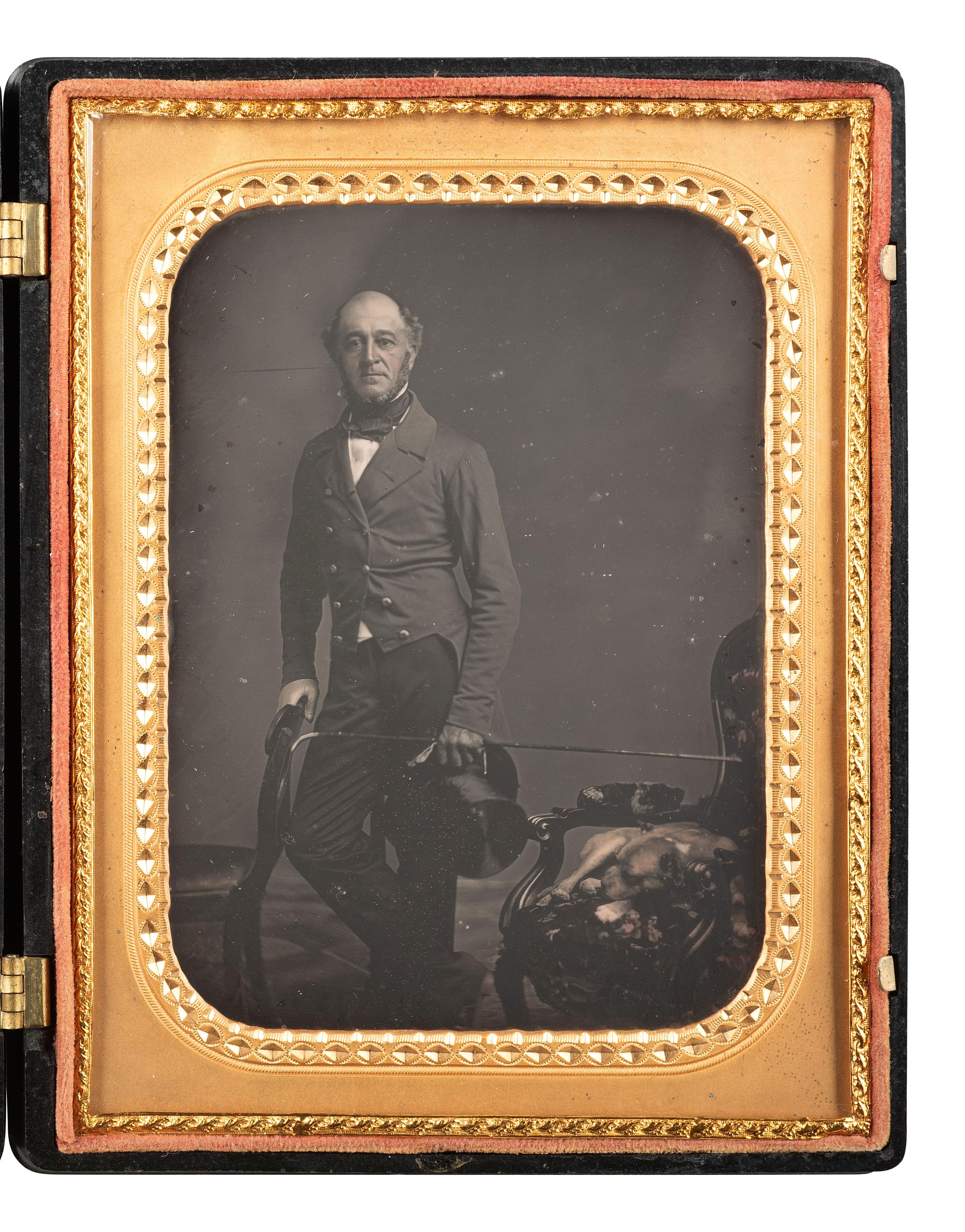 [EARLY PHOTOGRAPHY]. Half plate daguerreotype featuring a gentleman and his sleeping canine companion.