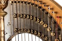 A Lyon & Healy Carved and Parcel Gilt Wood Harp