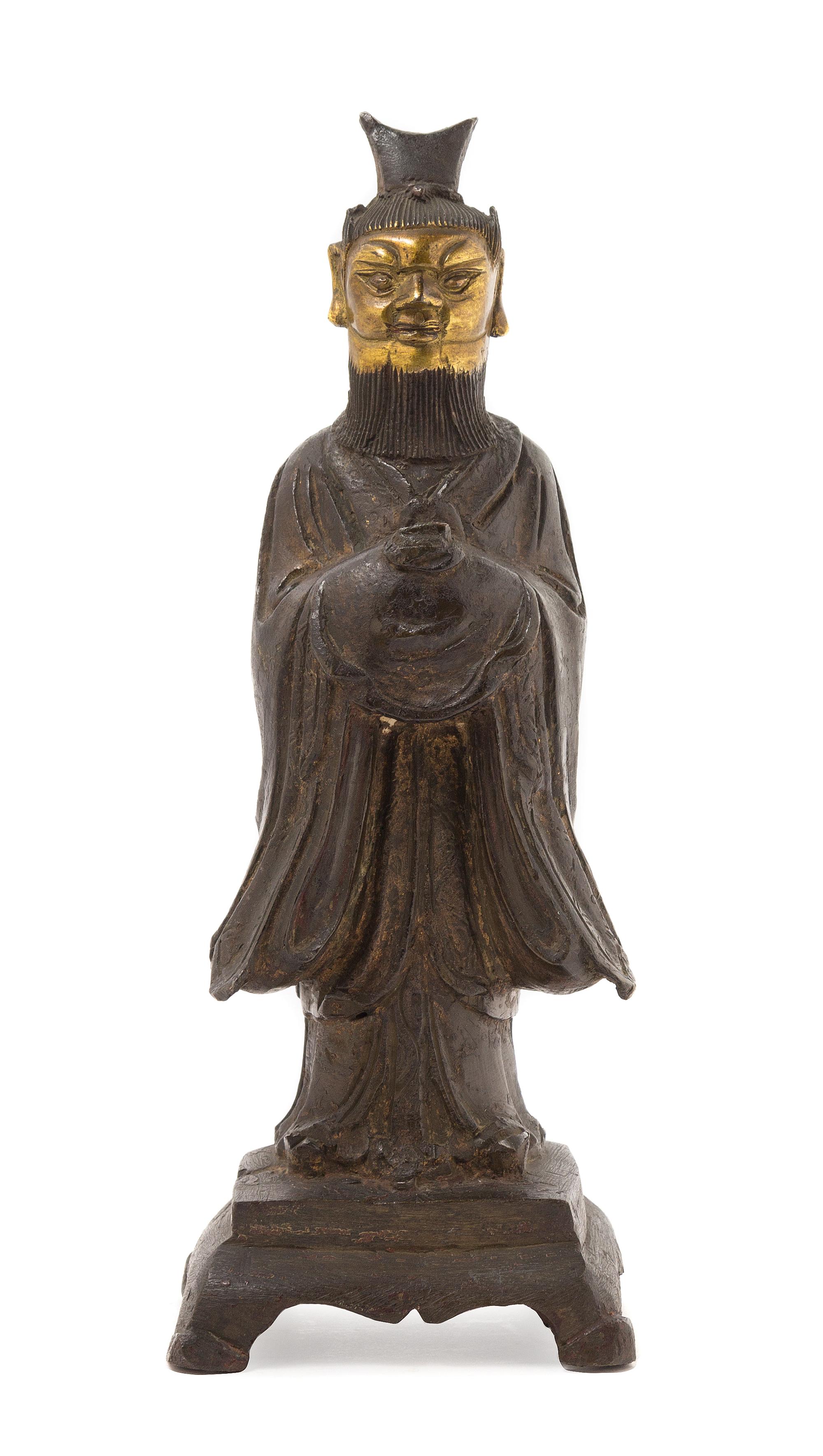 A Chinese Parcel Gilt Bronze Figure of a Daoist Immortal MING DYNASTY, 16TH/17TH CENTURY Height 10 1/4 x width 3 3/4 inches. — MING DYNASTY, 16TH/17TH CENTURY