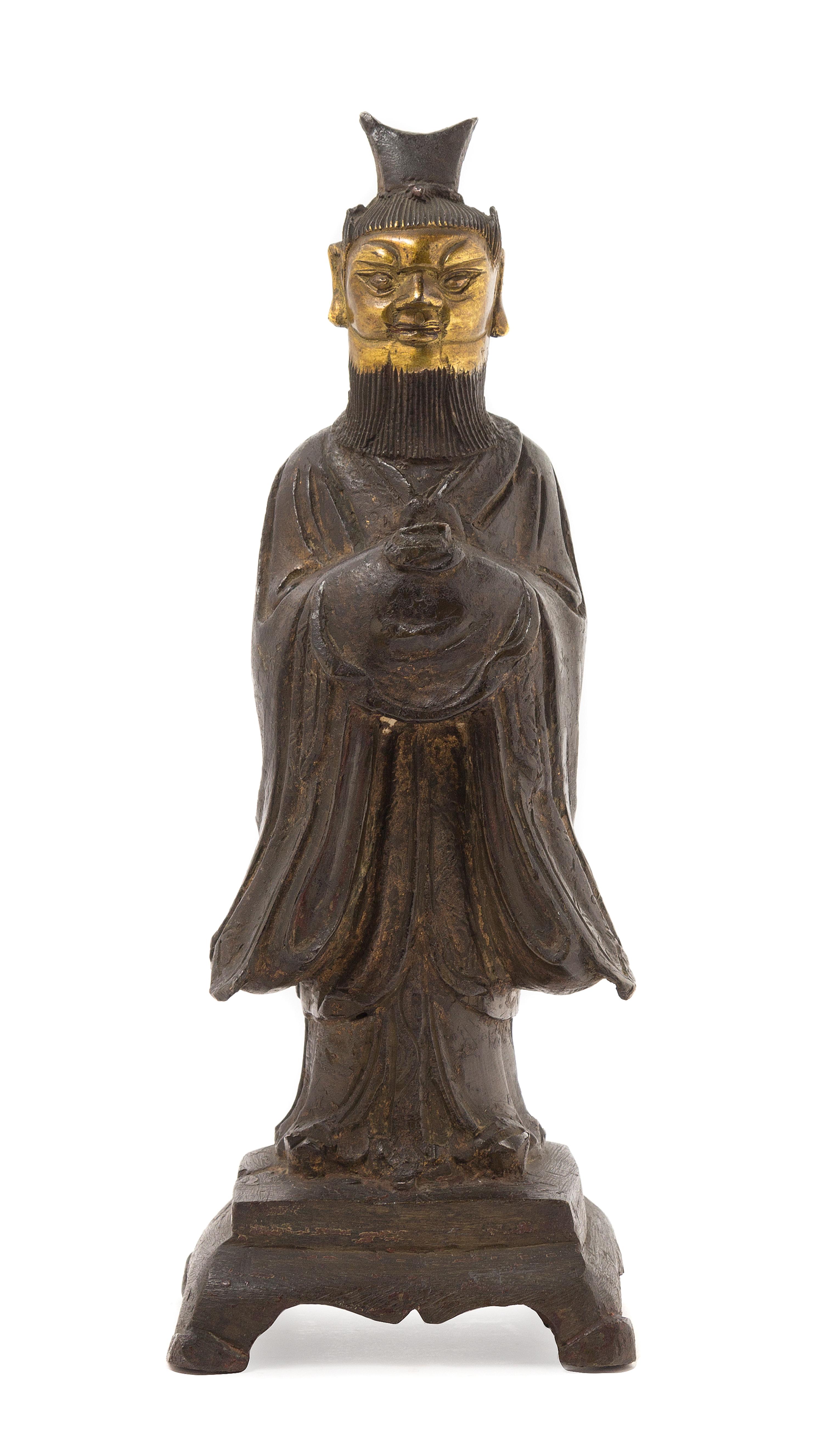 A Chinese Parcel Gilt Bronze Figure of a Daoist Immortal MING DYNASTY, 16TH/17TH CENTURY Height 10 1/4 x width 3 3/4 inches. — MING DYNASTY, 16TH/17TH CENTURY