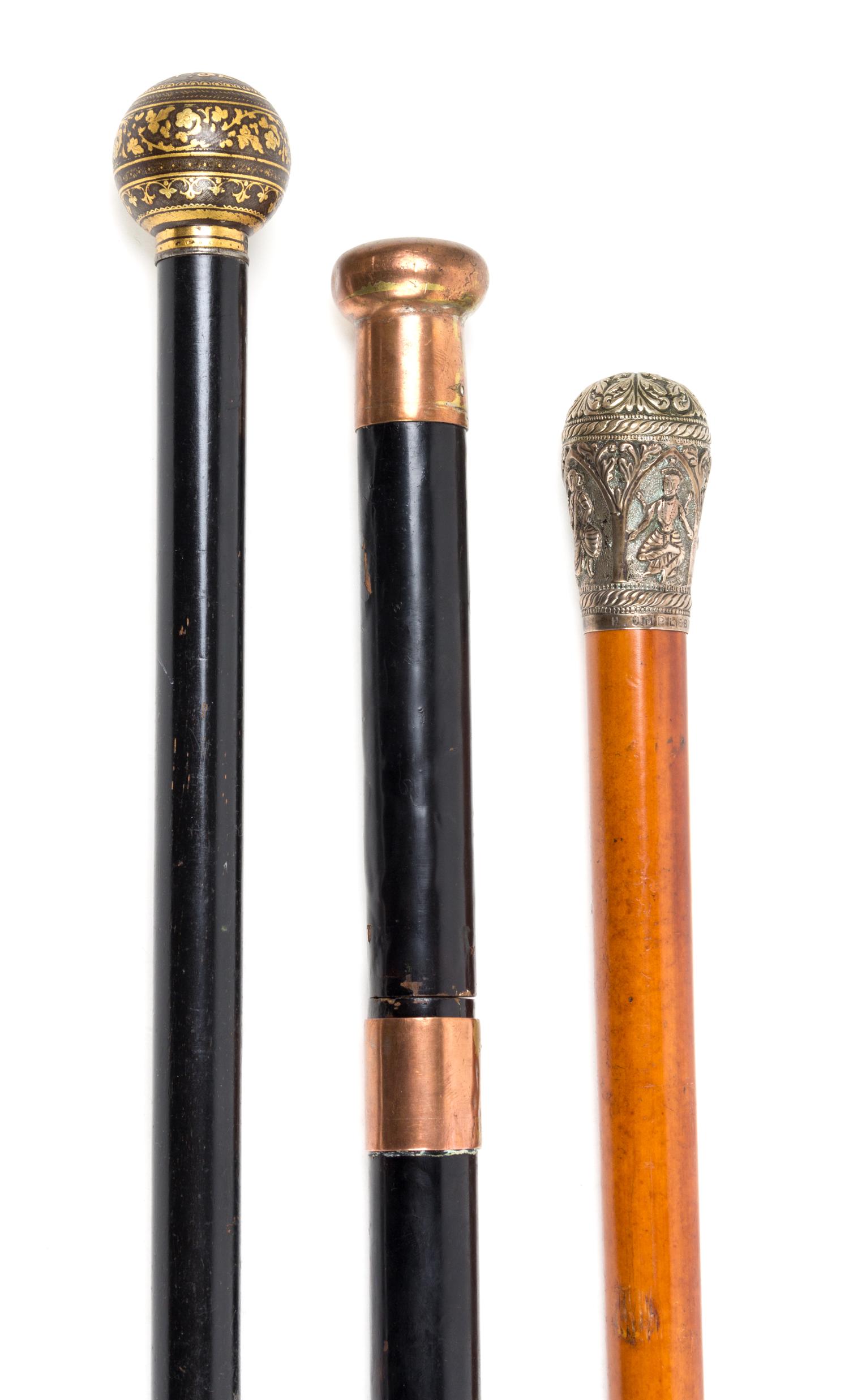 Three Knop Handled Canes Length of longest 36 1/4 inches.
