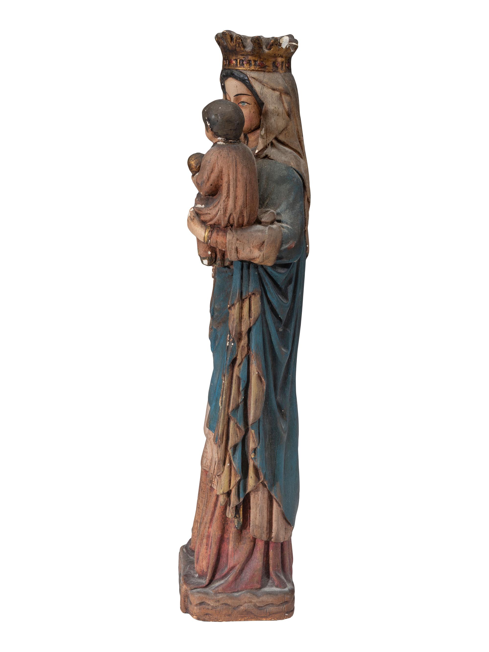 A Continental Paint Decorated Chalkware Santos Figure of the Madonna and Child