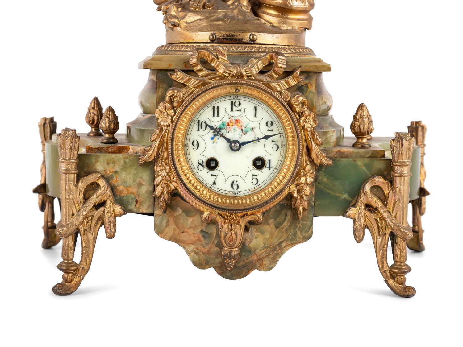 A Neoclassical Gilt Metal and Onyx Clock Garniture