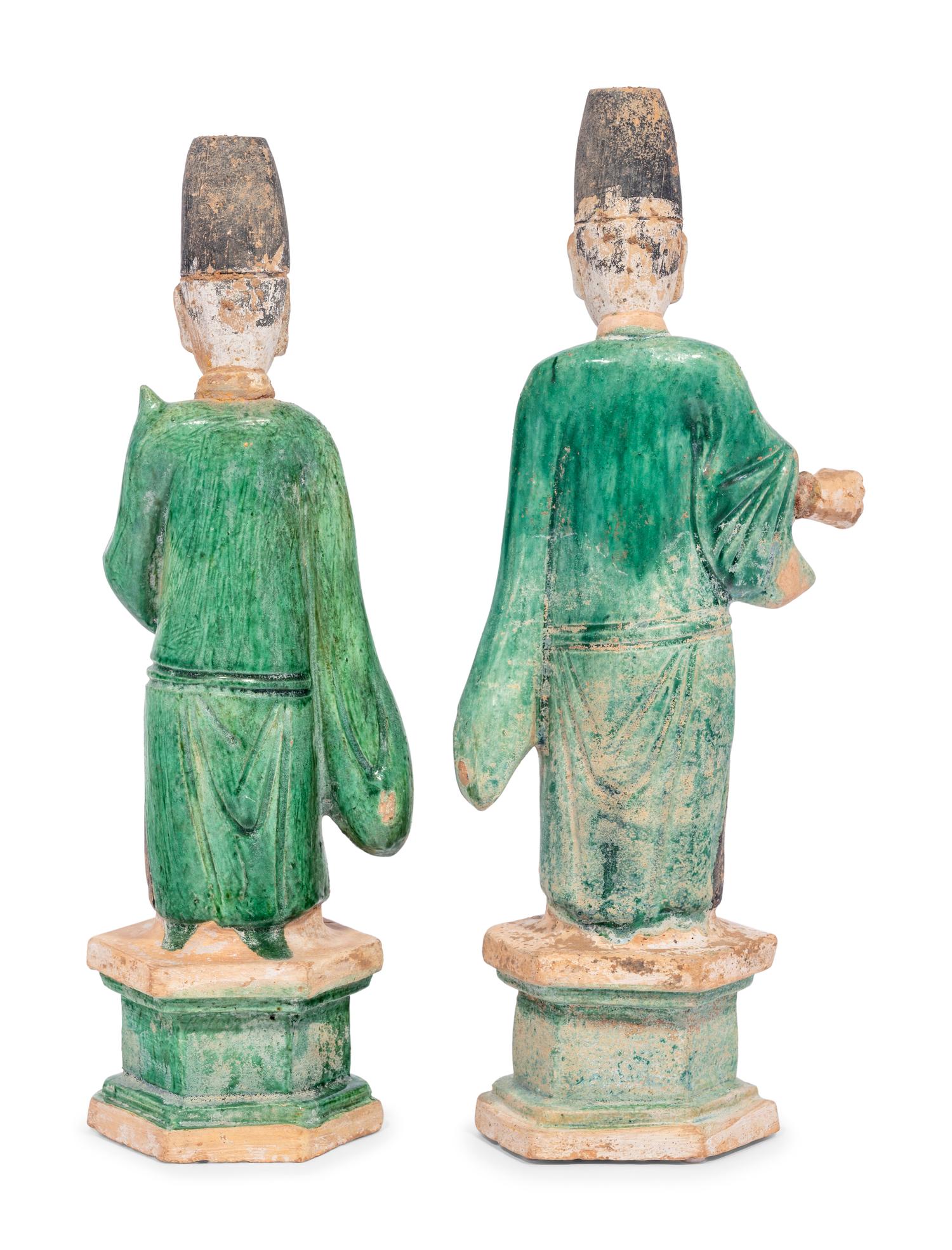 Two Chinese Green Glazed Pottery Figures of Attendants