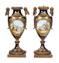 A Pair of Gilt Bronze Mounted Sèvres Style Porcelain Urns