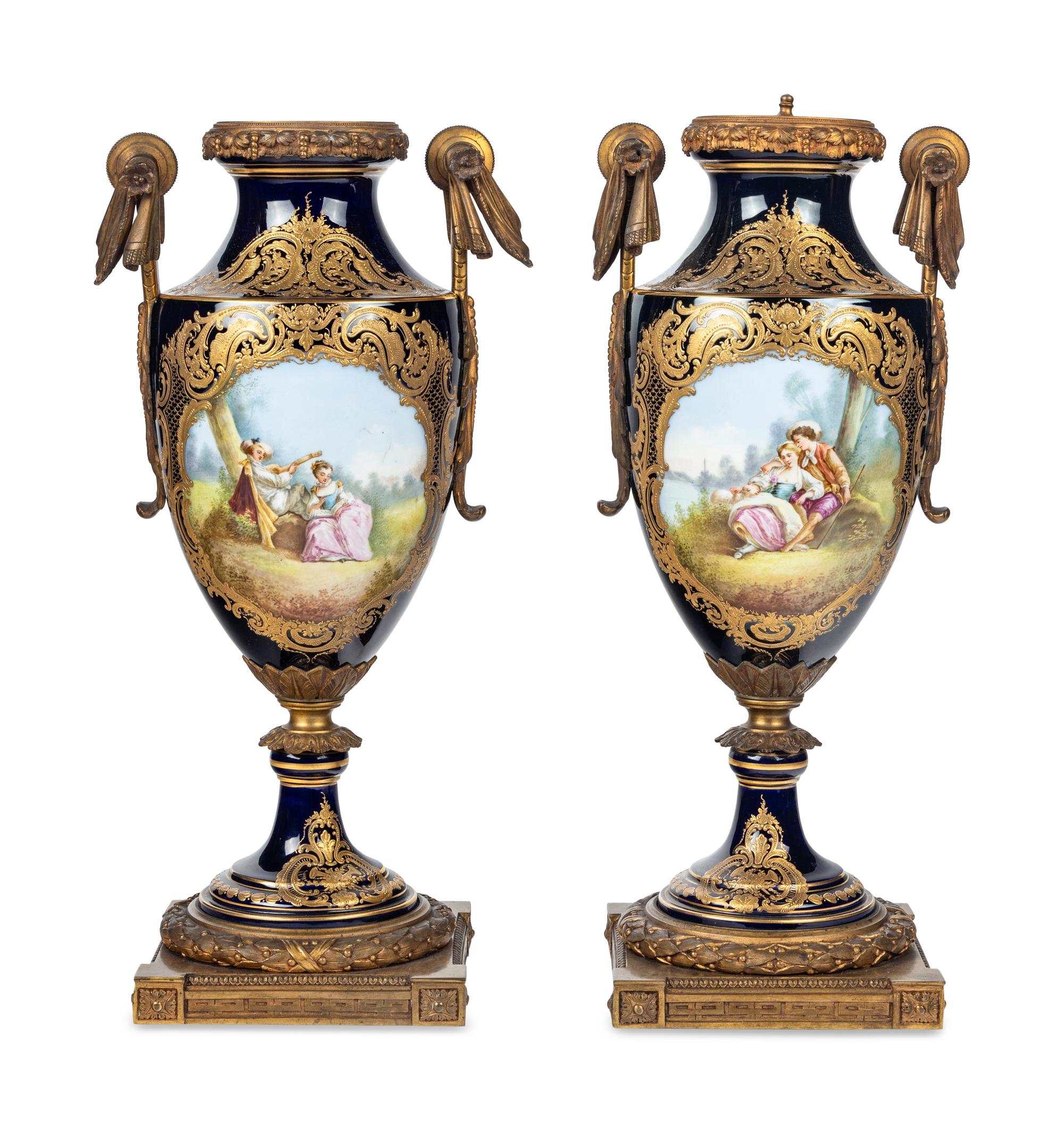 A Pair of Gilt Bronze Mounted Sèvres Style Porcelain Urns