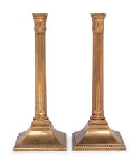 A Pair of George III Bronze Candlesticks