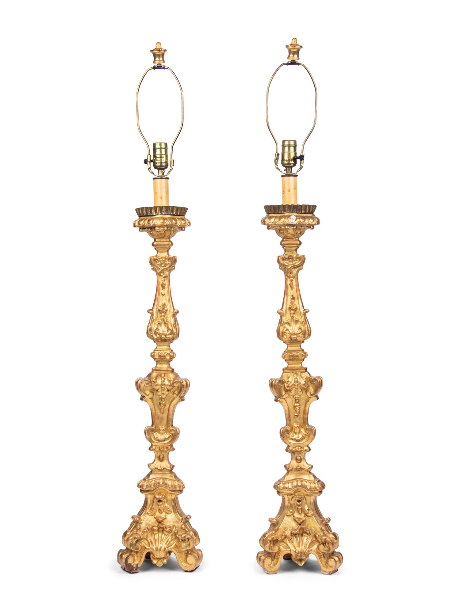 A Pair of Italian Giltwood Prickets Mounted as Lamps