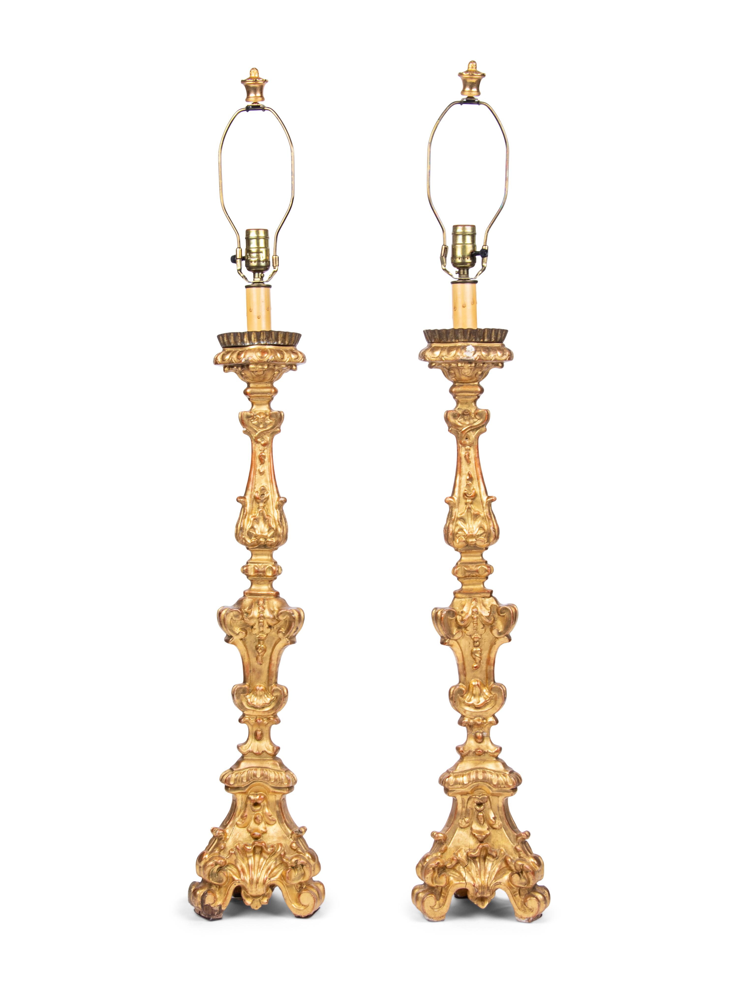 A Pair of Italian Giltwood Prickets Mounted as Lamps