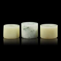 A Group of Three Chinese Jade and Jadeite Archer's Rings 翡翠及玉扳指一組三件