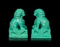 A Pair of Chinese Molded Glass Figures of Fu Lions