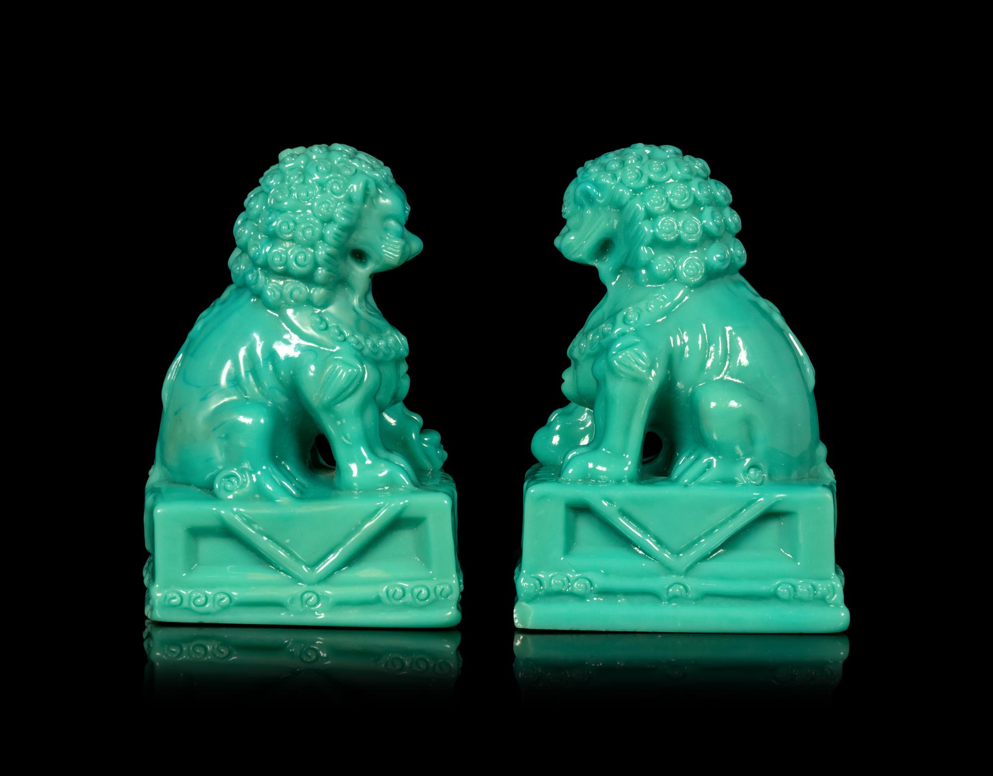 A Pair of Chinese Molded Glass Figures of Fu Lions