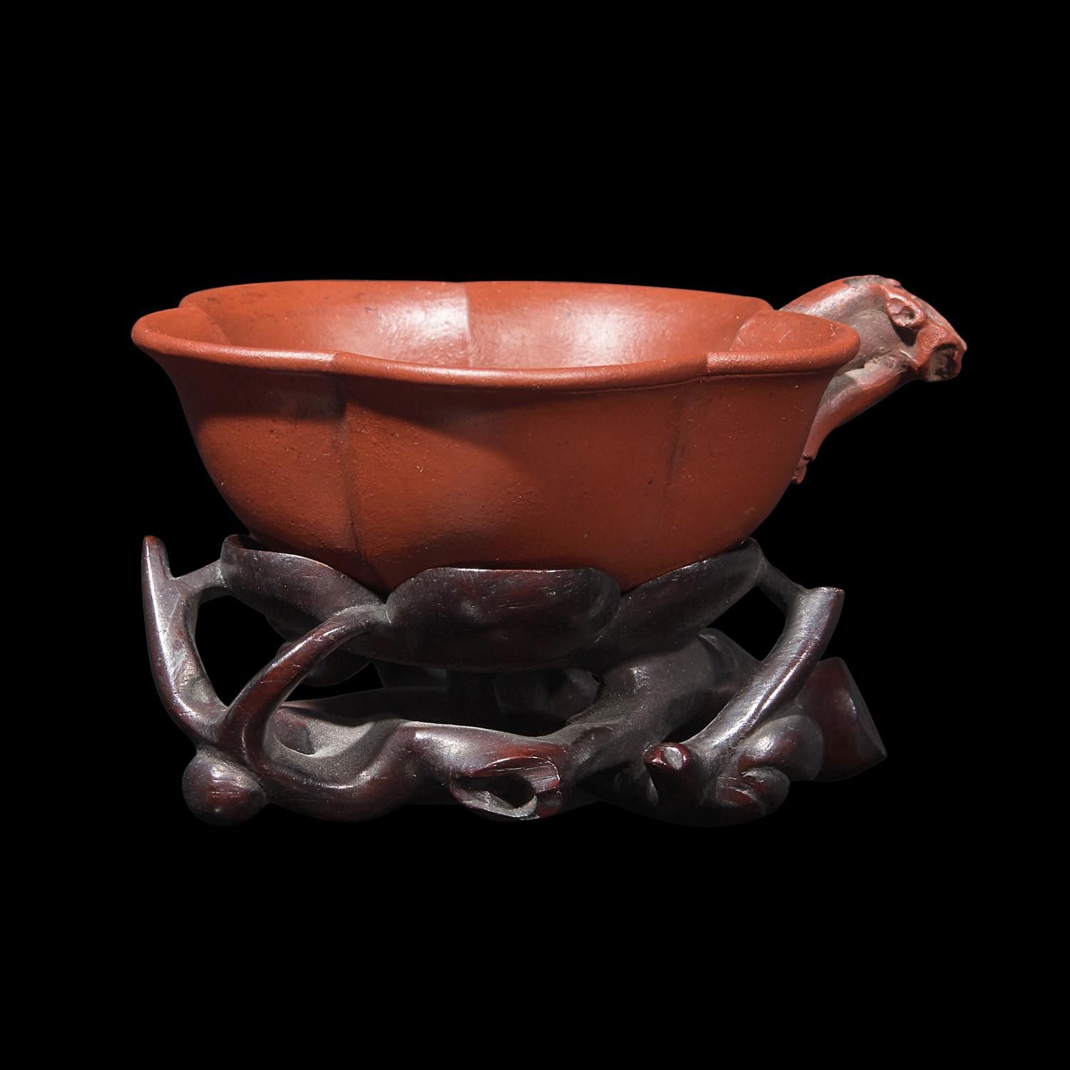 A Rare Yixing 'Prunus Blossom' Coupe with Impressed Seal 'Mingyuan', and Wood Stand 陳鳴遠款朱泥紫砂梅花杯