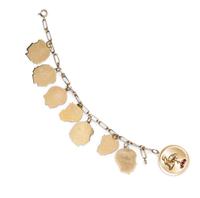 A 14 Karat Yellow Gold Charm Bracelet with Eight Attached Charms, 17.50 dwts.
