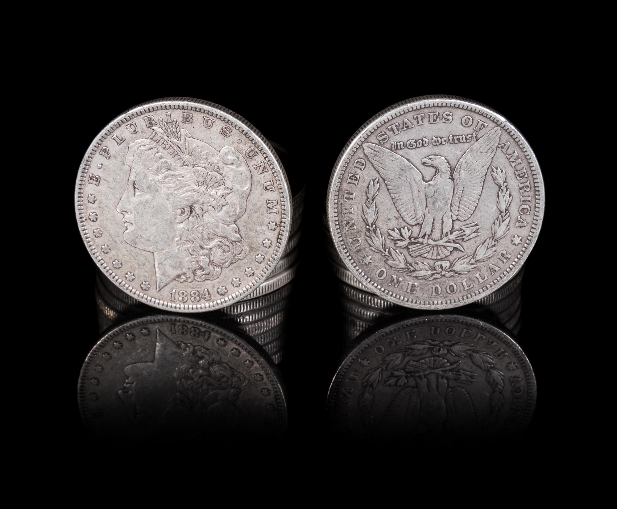 A Group of Thirteen United States 1884 Morgan Silver Dollar Coins